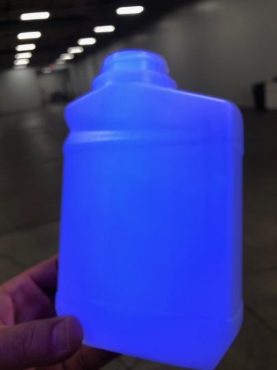 Blacklight illuminates the presence of Kortrax® in the bottle.